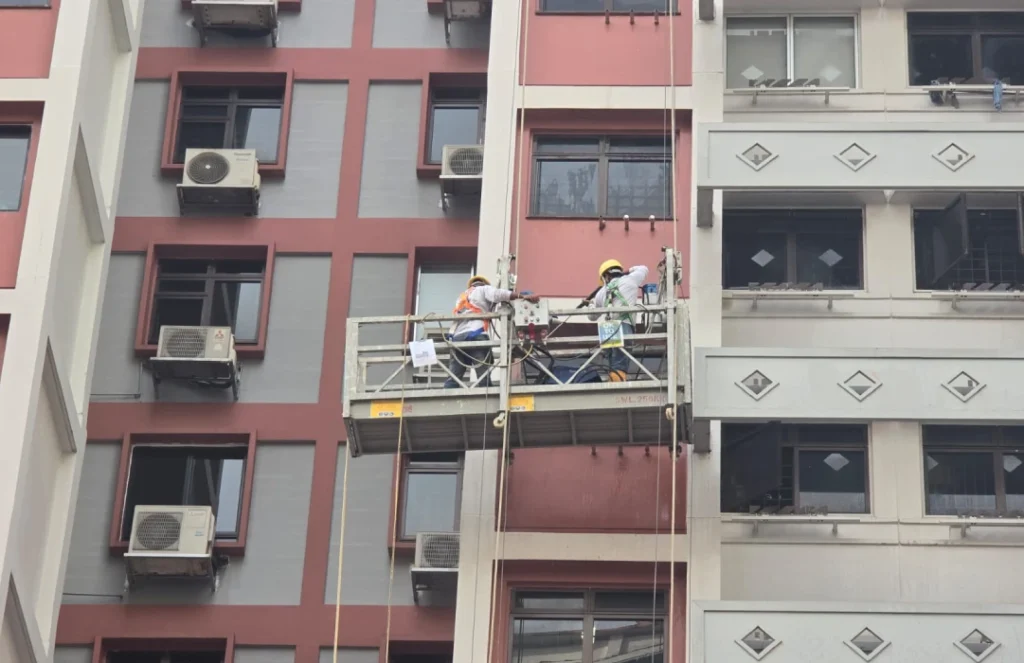 Condo exterior repaint using gondola platform, Singapore painter service