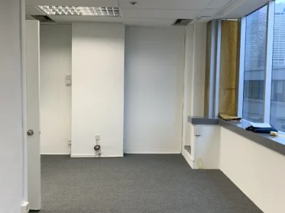 Empty HDB room with ceiling light before white repaint, Singapore