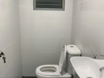 HDB toilet with white tiles, before repaint Painting Singapore service