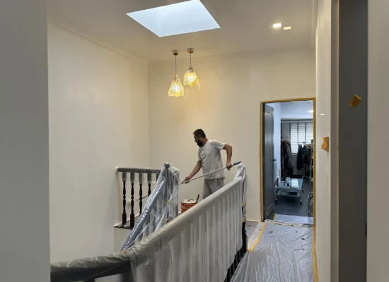 Painter extension pole staircase area, HDB Singapore repaint