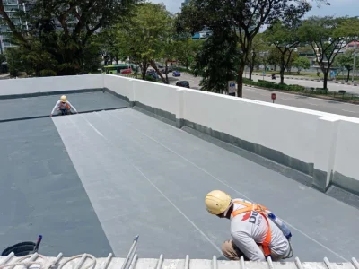 Rooftop waterproofing Singapore – workers installing grey membrane on HDB roof