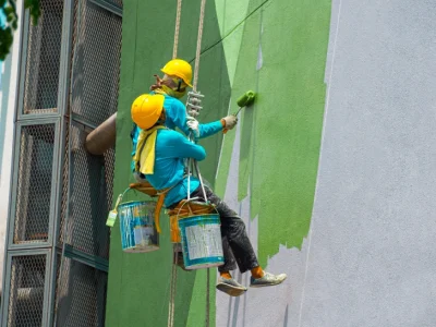 Two rope painters green wall Singapore exterior spray paint